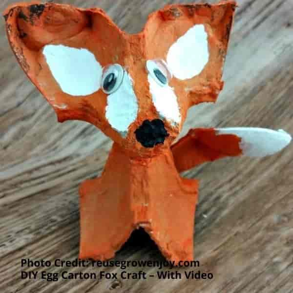 Shows a completed craft creation of a fox using egg cartons Create an egg carton fox